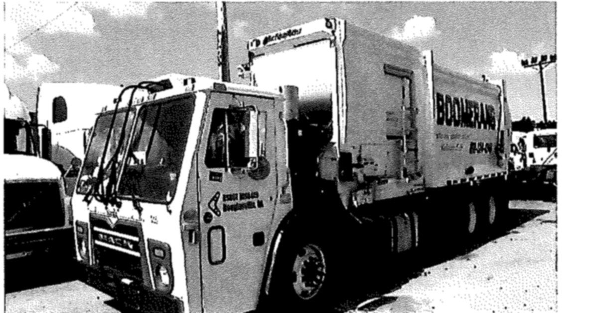Scanned photo of a used 2015 Mack side-loader garbage truck, from the July 30 council packet
